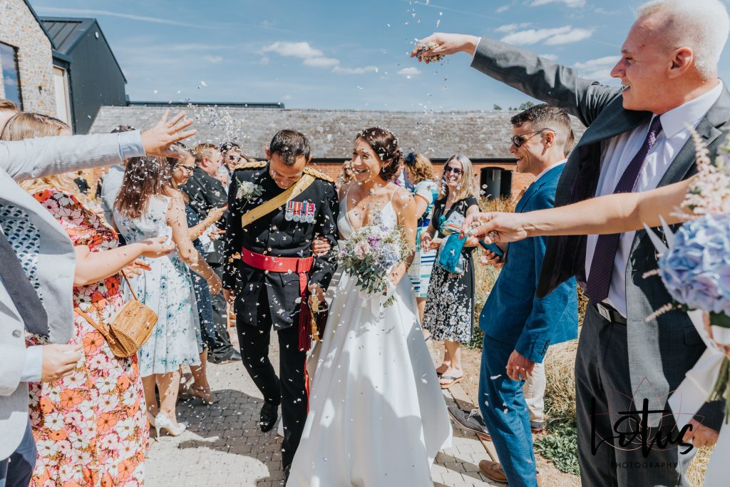confetti being thrown at a wedding