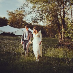Bride and groom in front of Capri Tent
