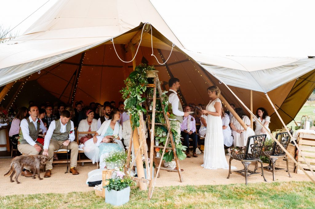 Ceremony in the tipi at sussex wedding venue