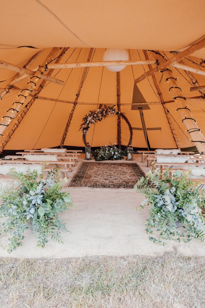 ceremony tipi for a blank canvas wedding in the rain